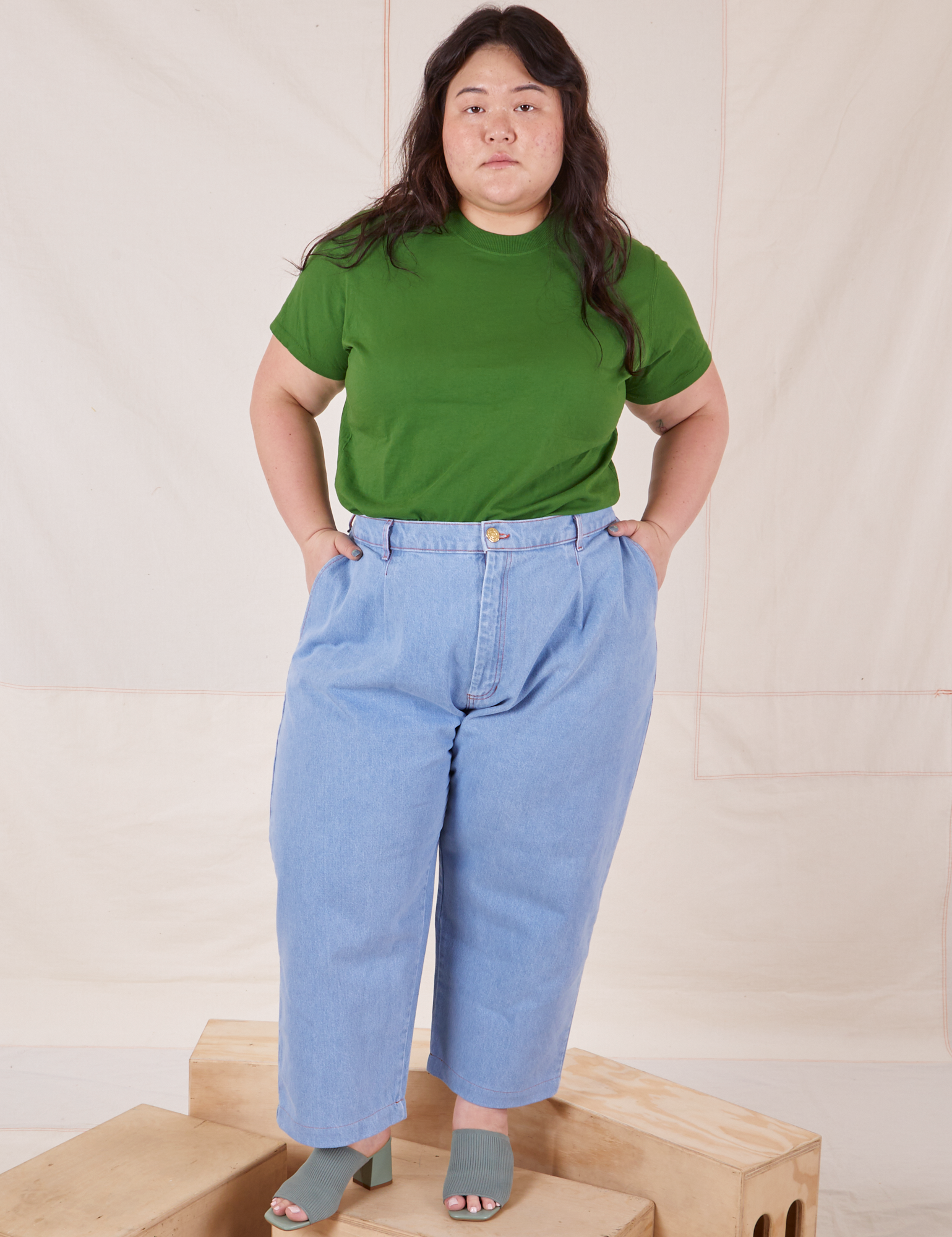 Ashley is wearing Organic Vintage Tee in Lawn Green and light wash Trouser Jeans