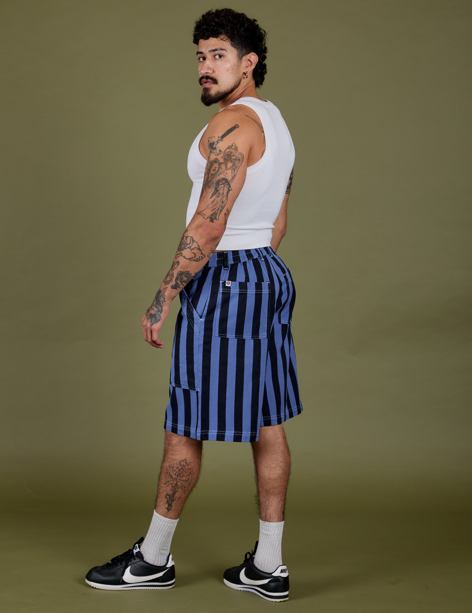 Side view of Longline Work Shorts in Cornflower and Cropped Tank in Vintage Tee White on Jesse