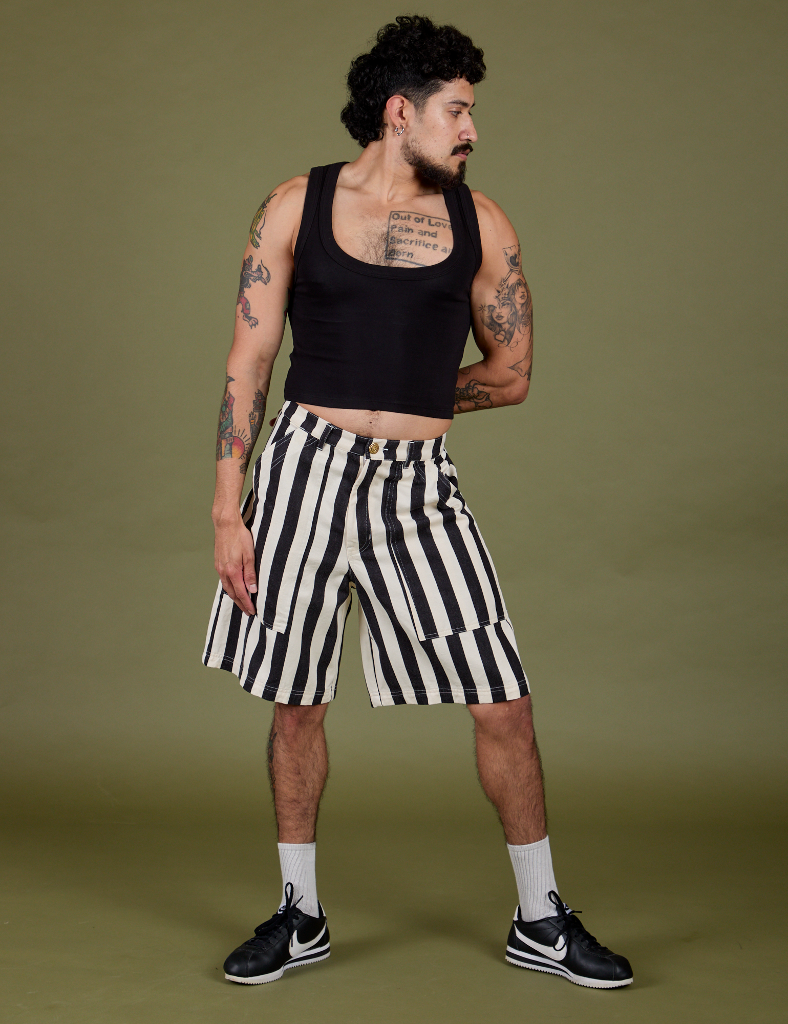 Jesse is 5’8” and wearing S Longline Work Shorts in Natural paired with black Cropped Tank