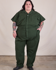 Sam is 5'10" and wearing 4XL Long Jumpsuit in Swamp Green