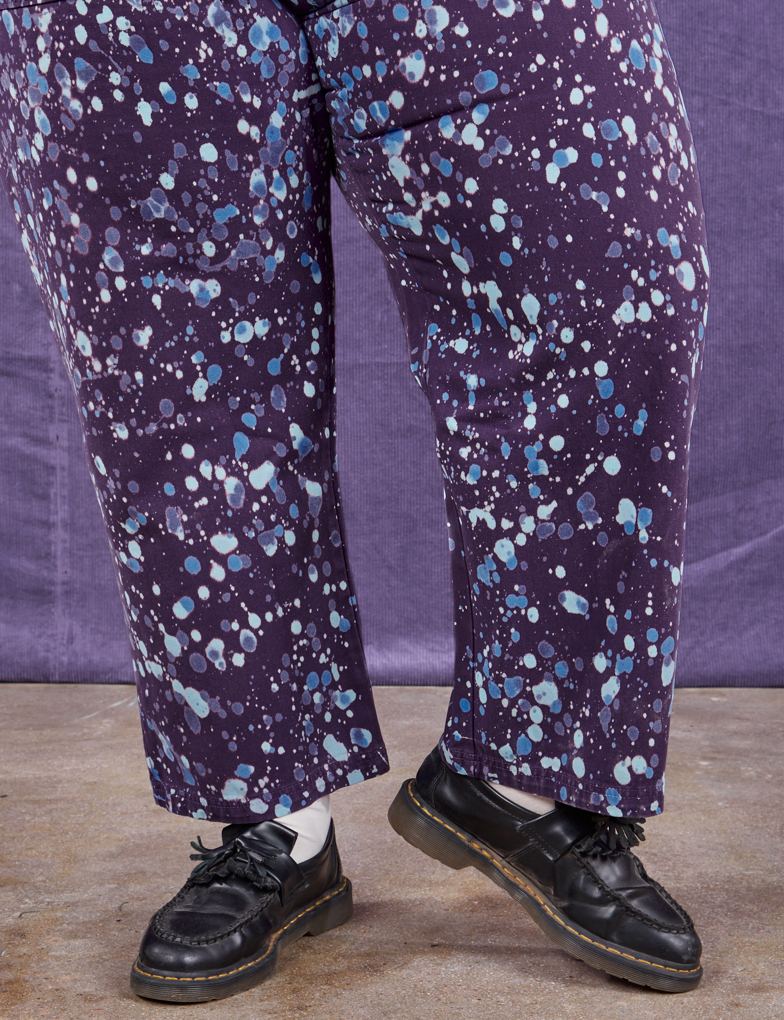 Marble Splatter Work Pants in Nebula Purple pant leg close up on Sam