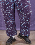 Marble Splatter Work Pants in Nebula Purple pant leg close up on Sam