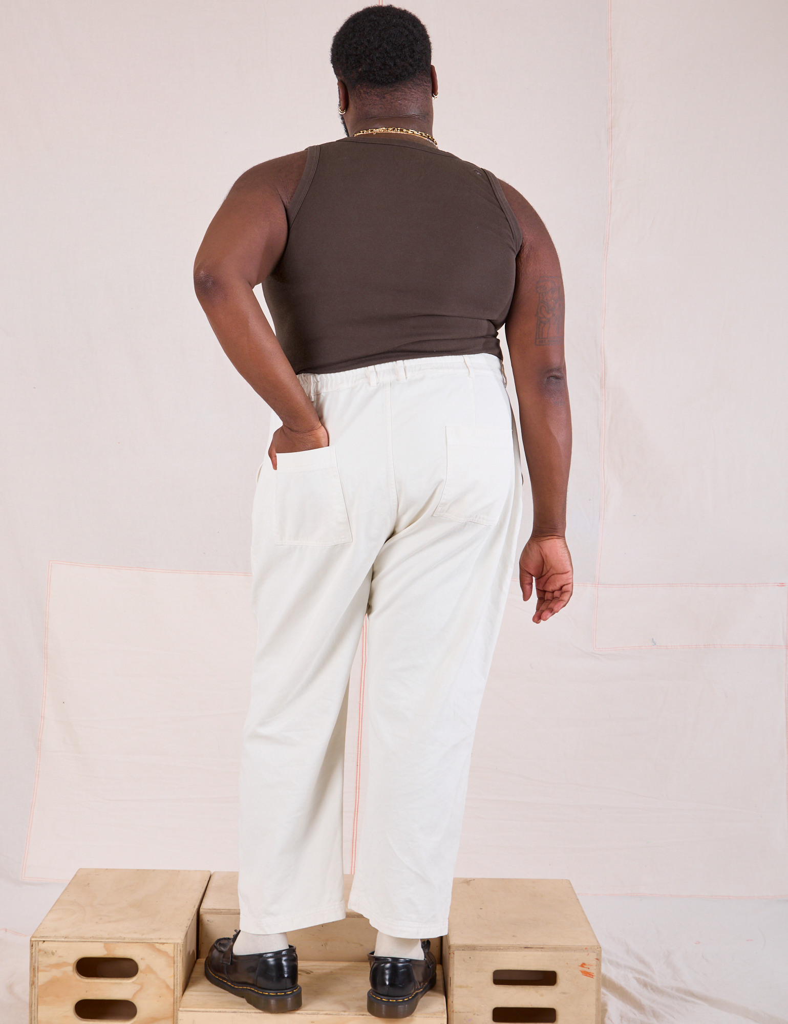 Back view of Masters Work Pants and espresso brown Tank Top on Elijah