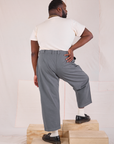 Back view of Mid-Rise Pleated Trousers in Slate Grey and Organic Vintage Tee in vintage tee off-white on Elijah