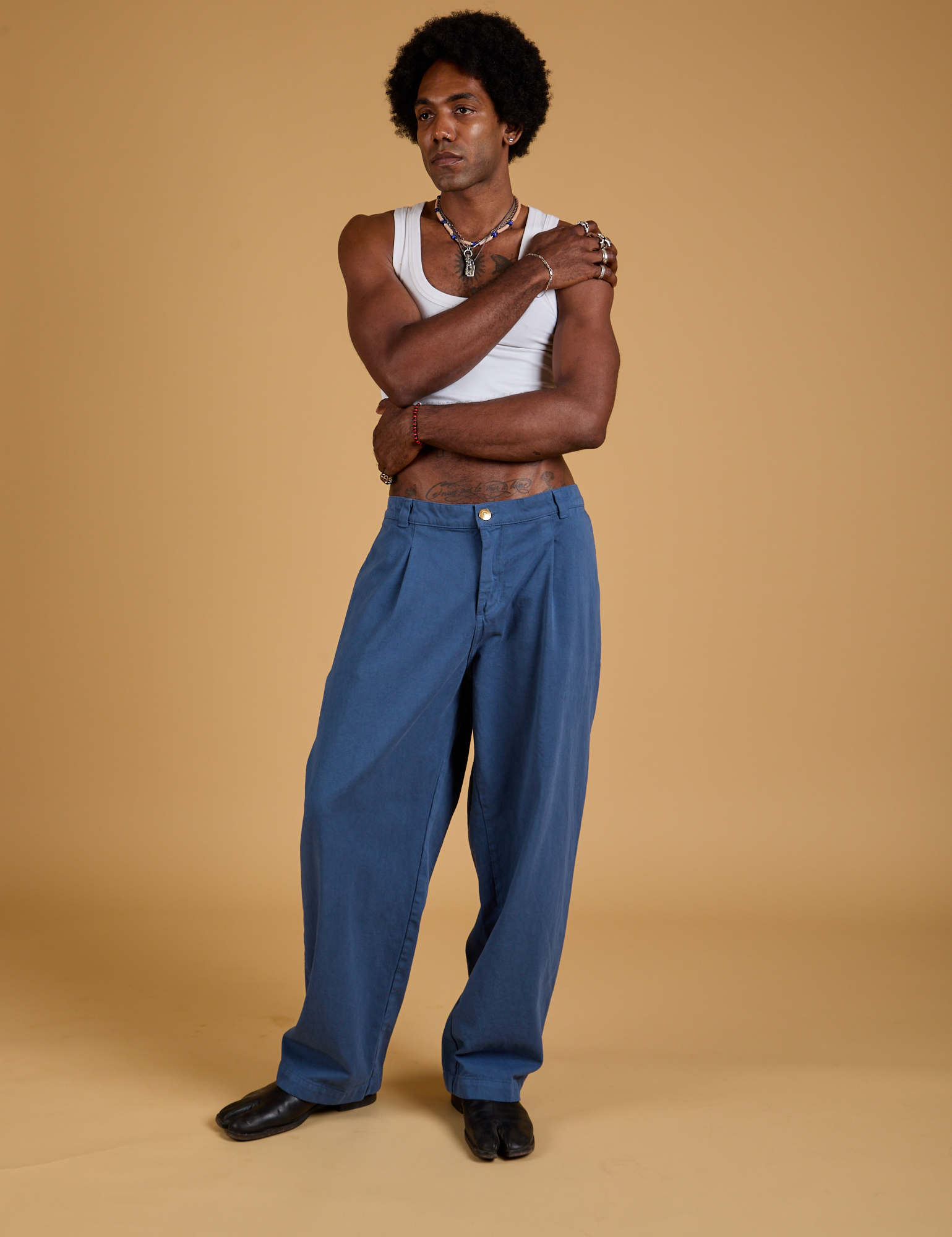 Baggy Mid-Rise Trousers in French Blue and vintage tee Cropped Tank on Jerrod