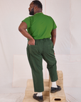 Back view of Mid-Rise Work Pants in Swamp Green and lawn green Organic Vintage Tee on Elijah