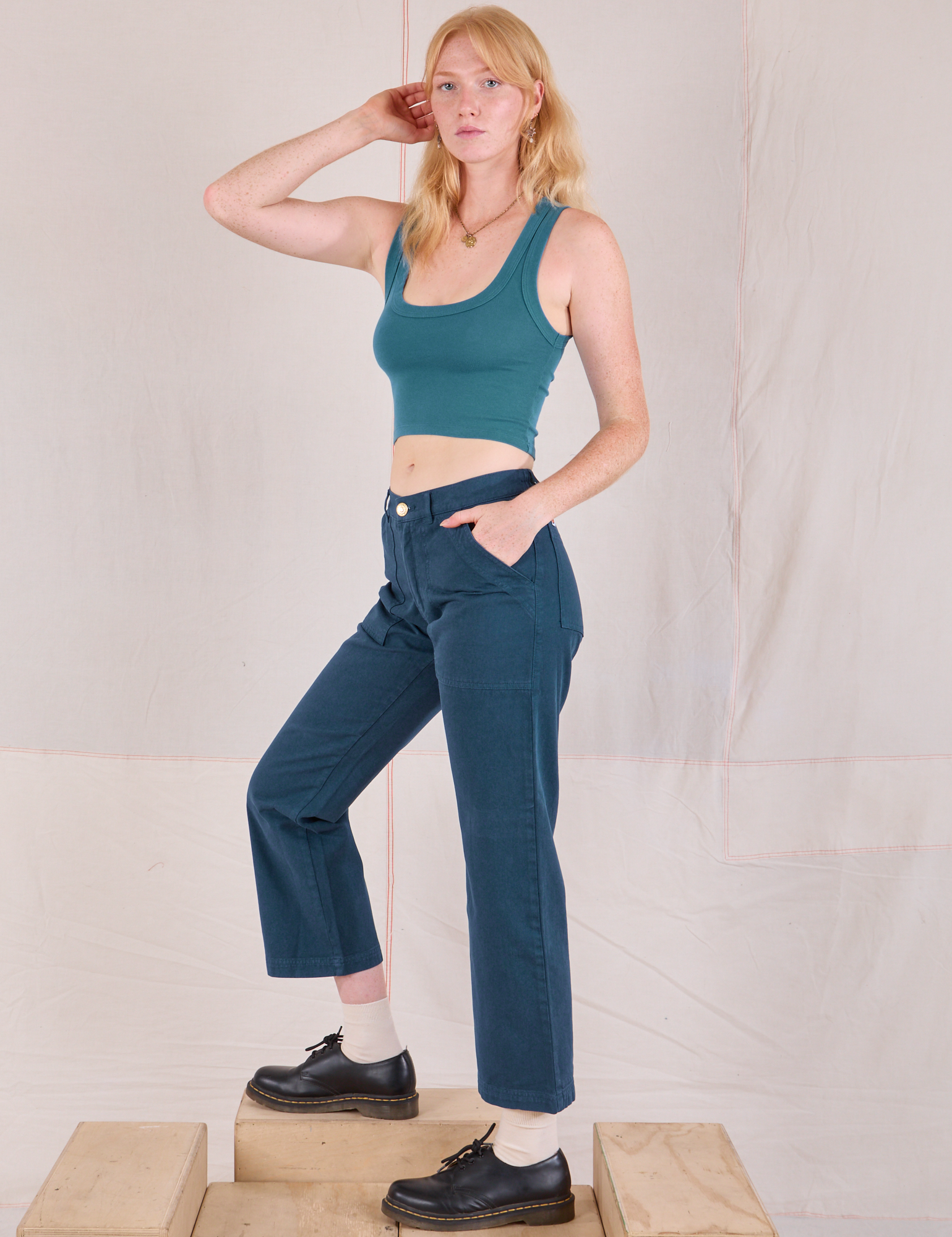 Side view of Mid-Rise Work Pants in Lagoon and marine blue Cropped Tank on Margaret