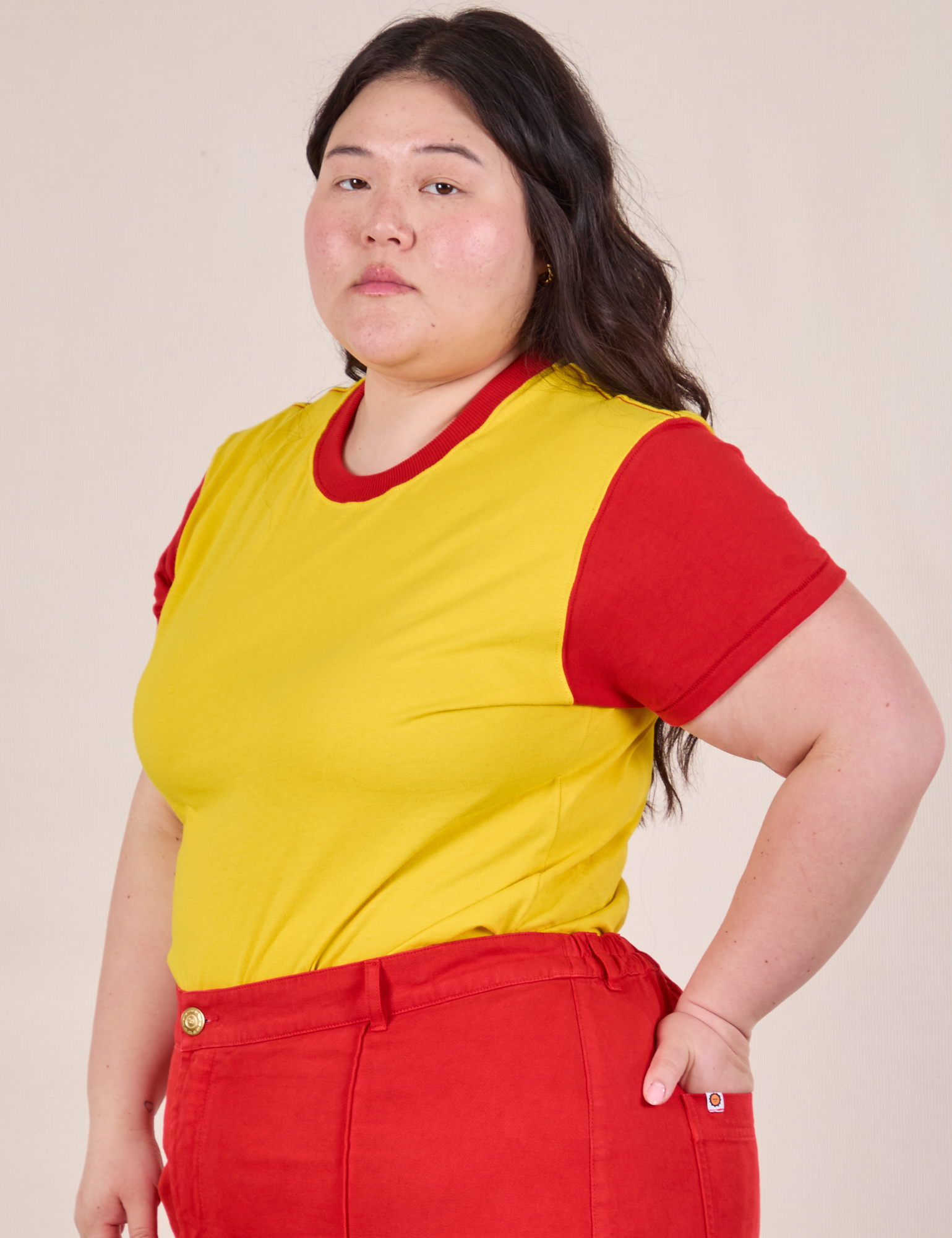Angled front view of Mismatched Tee in Yellow &amp; Red on Ashley