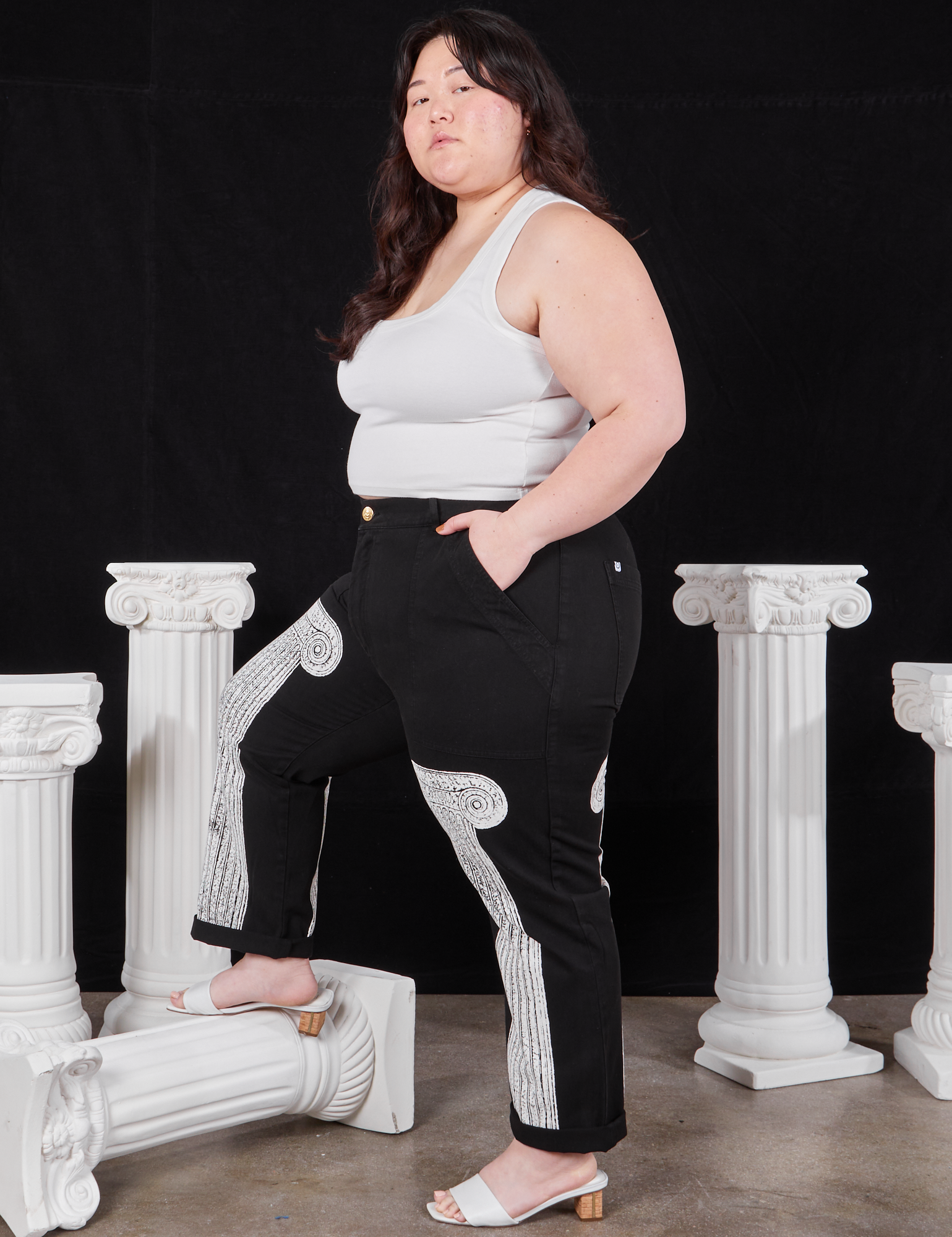 Side view of Column Work Pants in Basic Black and vintage off-white Cropped Tank Top on Ashley