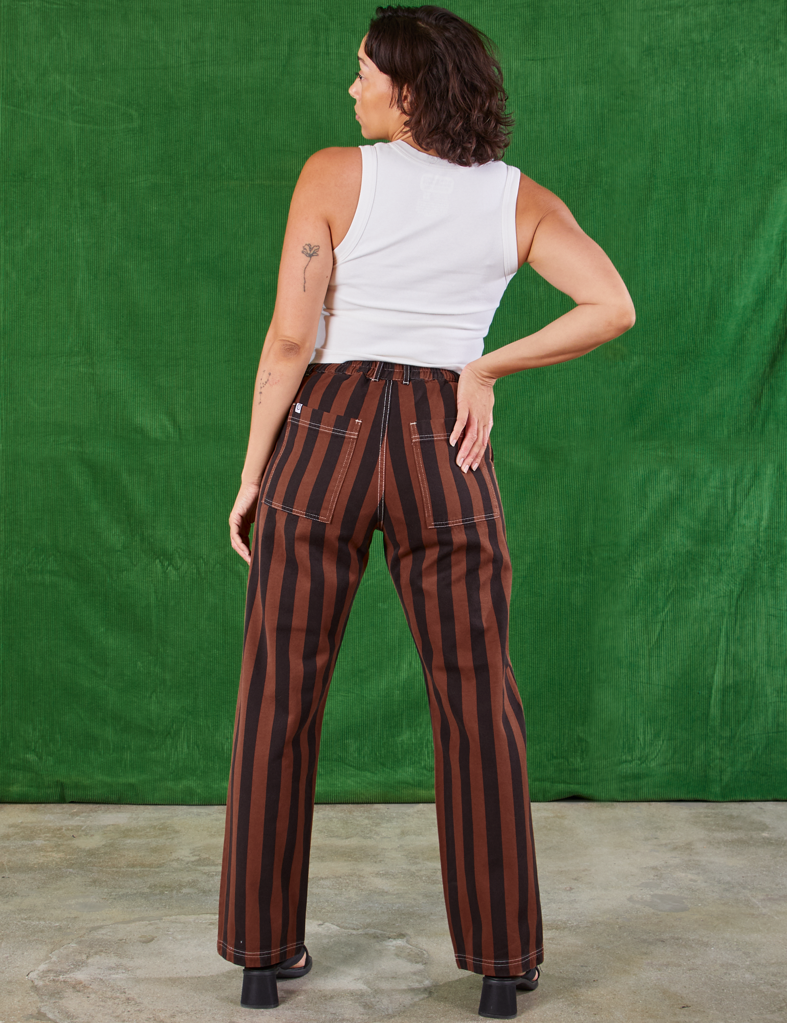 Back view of Black Stripe Work Pants in Fudgesicle Brown and Cropped Tank on Tiara