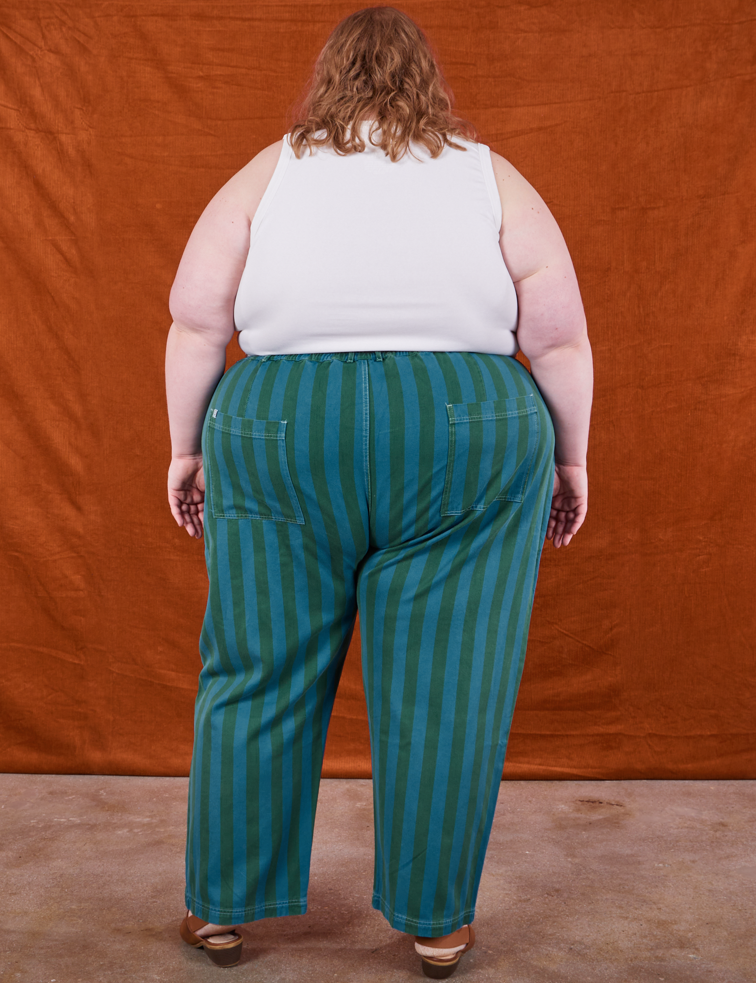 Back view of Overdye Stripe Work Pants in Blue/Green and vintage off-white Cropped Tank Top on Catie