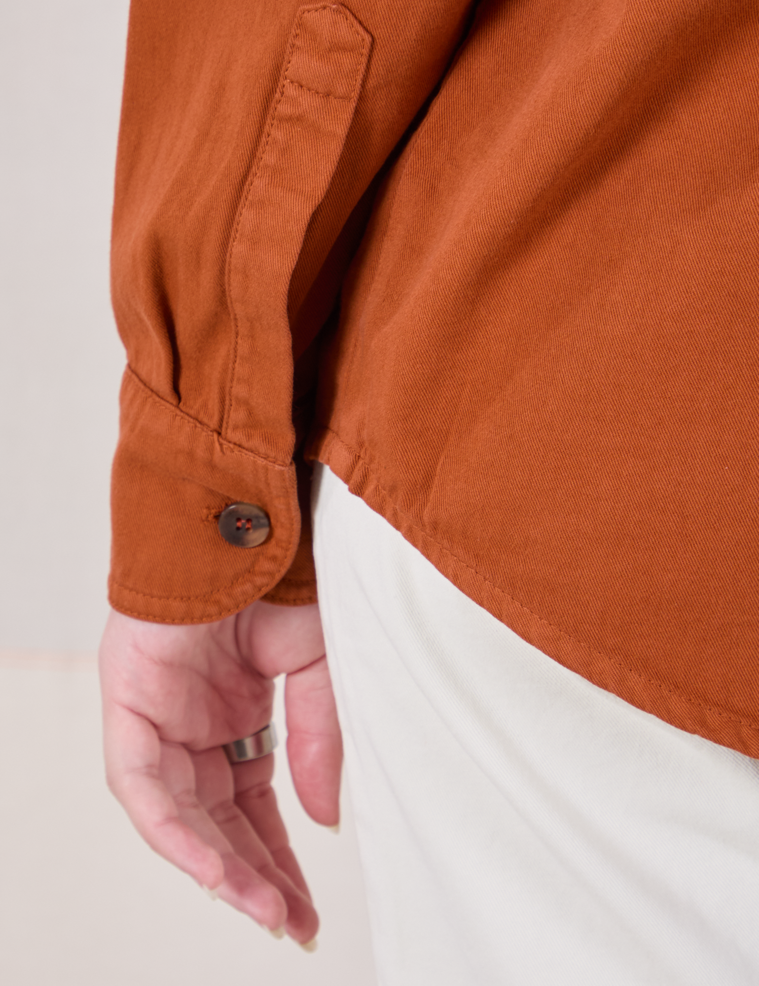 Twill Overshirt in Burnt Terracotta sleeve cuff close up on Alex