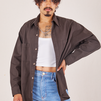 Jesse is wearing size S Oversize Overshirt in Espresso Brown and a vintage off-white Cropped Tank Top underneath