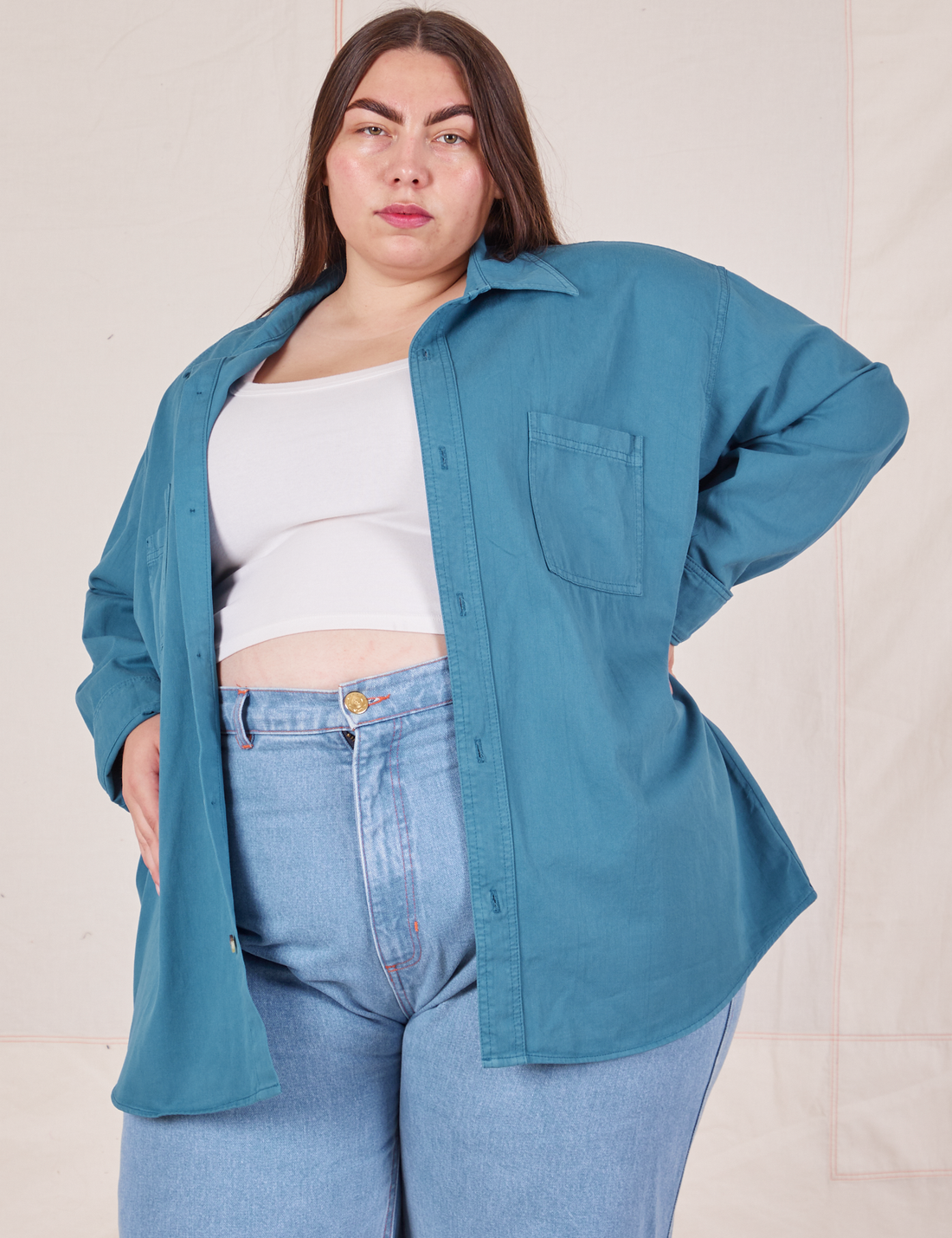 Marielena is wearing Oversize Overshirt in Marine Blue and a vintage off-white Cropped Tank Top underneath