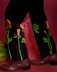Paintstamped Work Pants in Poppy pant leg bottom close up on Jesse