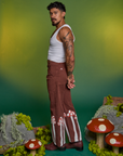 Side view of Paintstamped Work Pants in Mushroom and Cropped Tank in Vintage Tee White on Jesse