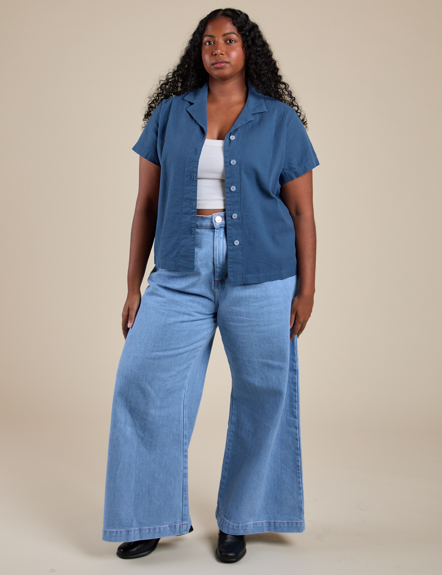 Meghna is wearing Pantry Button-Up in French Blue and light wash Indigo Wide Leg Trousers