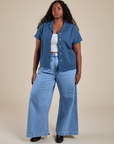 Meghna is wearing Pantry Button-Up in French Blue and light wash Indigo Wide Leg Trousers
