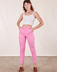 Alex is wearing Pencil Pants in Bubblegum Pink and vintage off-white Cami