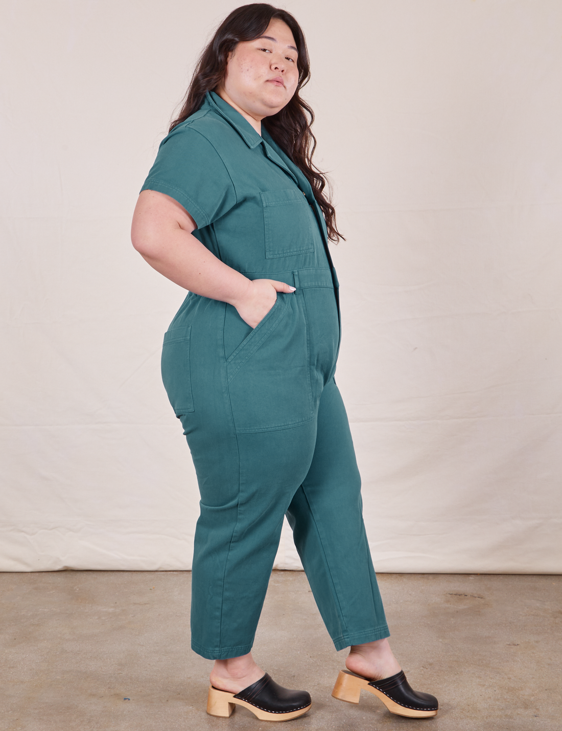 Petite Short Sleeve Jumpsuit in Marine Blue side view on Ashley