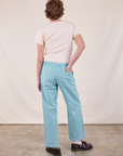 Back view of Work Pants in Baby Blue and Burly Tee in Vintage Tee Off-White on Quinn