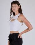 Side View of Alex wearing the Vintage Tee White Porthole Tank
