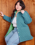 Ashley is wearing Quilted Overcoat in Marine Blue