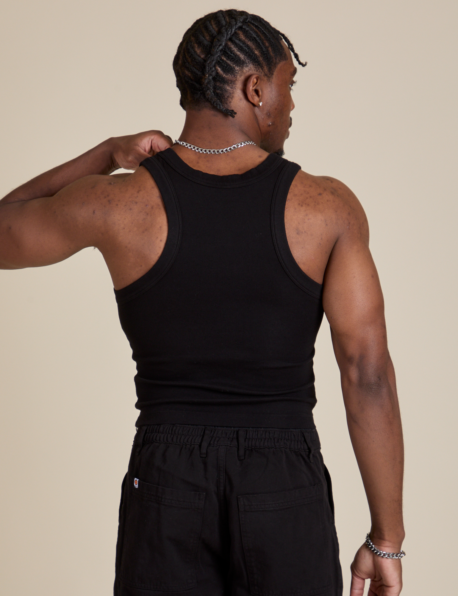 Racerback Tank in Black back view on Isaac