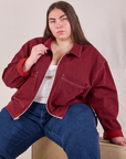 Marielena is 5'8" and wearing 1XL Mechanic Jacket in Mustang Red