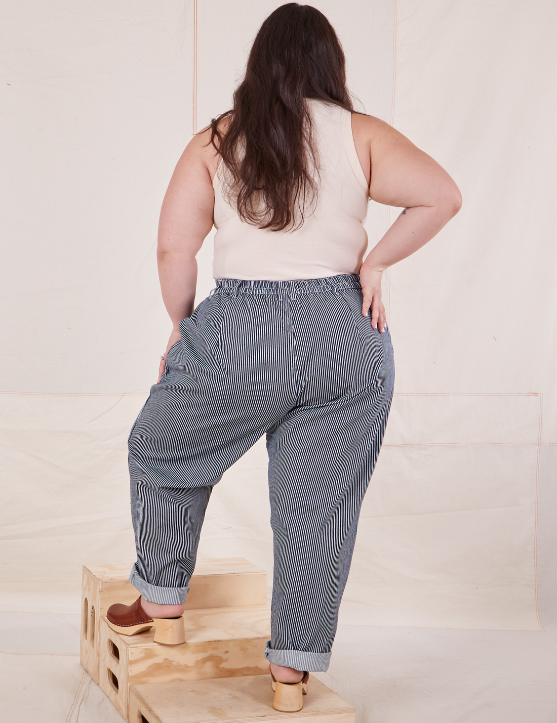 Back view of Denim Trouser Jeans in Railroad Stripe and vintage off-white Tank Top worn by Ashley