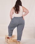 Back view of Denim Trouser Jeans in Railroad Stripe and vintage off-white Tank Top worn by Ashley