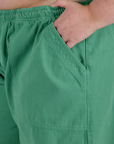 Close up of Juliet's hand in the front pocket of Drop Pocket Cargo Pants in Seafoam Green