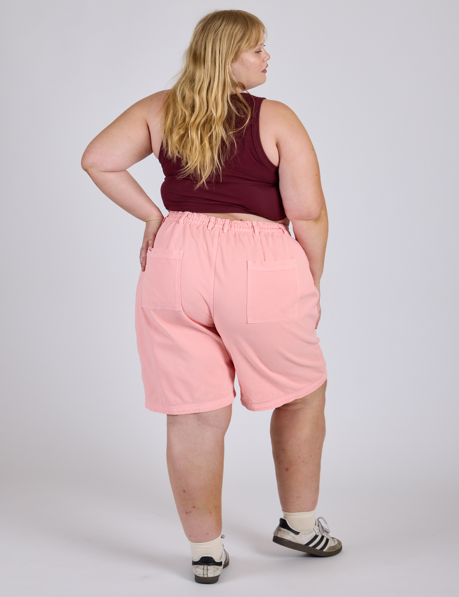 Longline Work Shorts in Baby Pink back view on Juliet