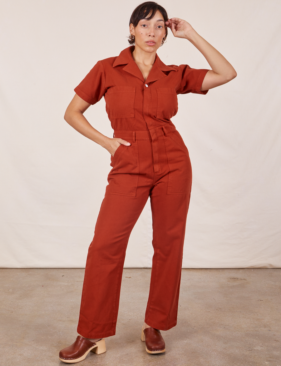 Tiara is 5'4" and wearing S Short Sleeve Jumpsuit in Paprika
