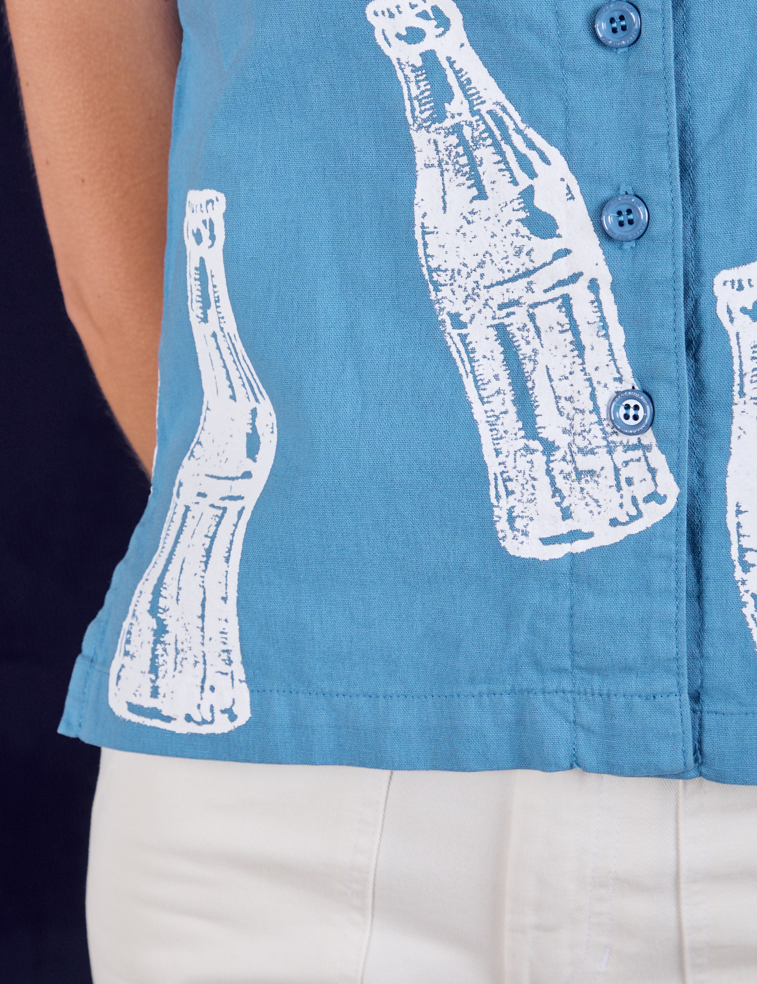 Soda Bottle Pantry Button-Up in Greek Blue close up on Madeline