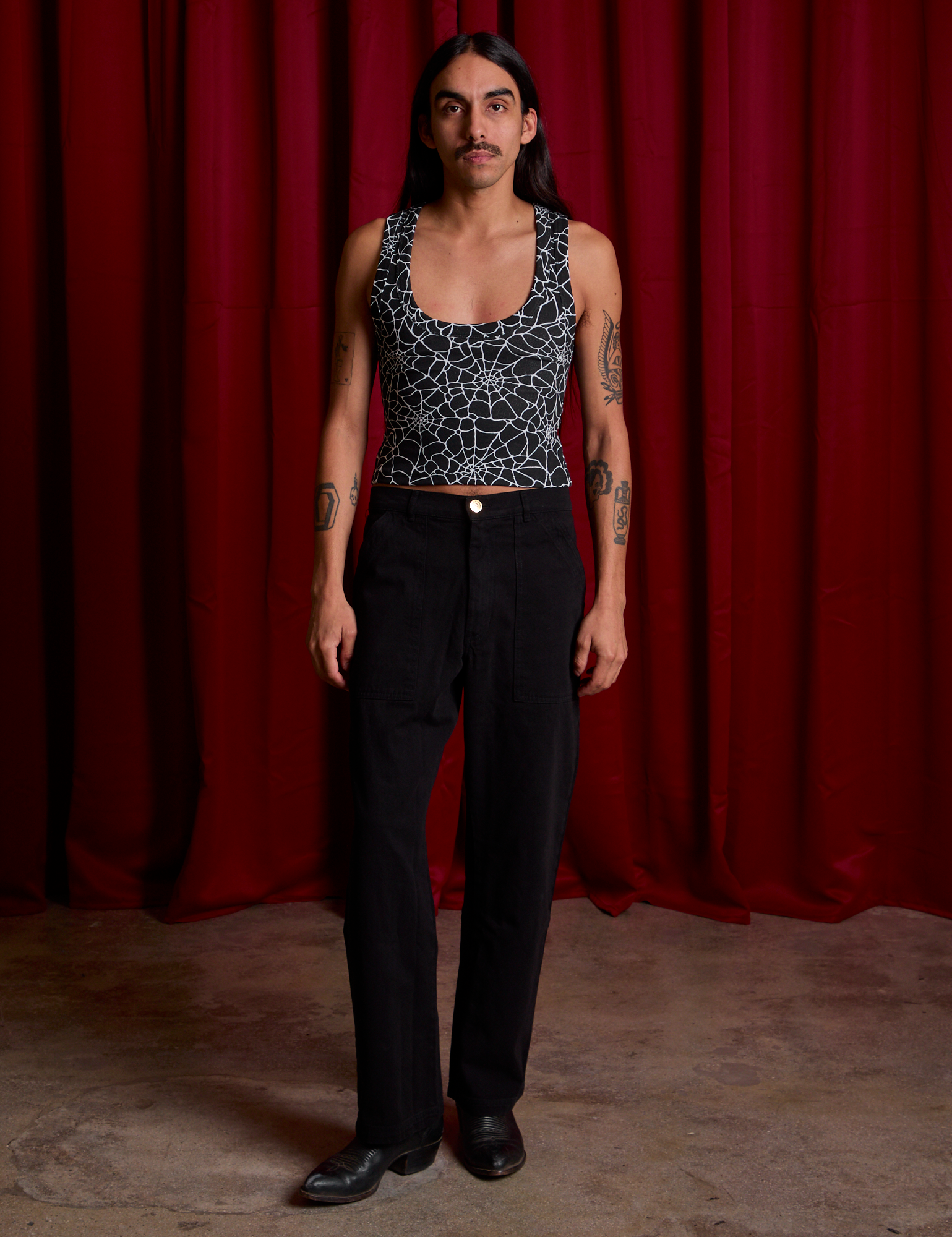 Cropped Tank Top in Spider Webs and black Work Pants on Anthony