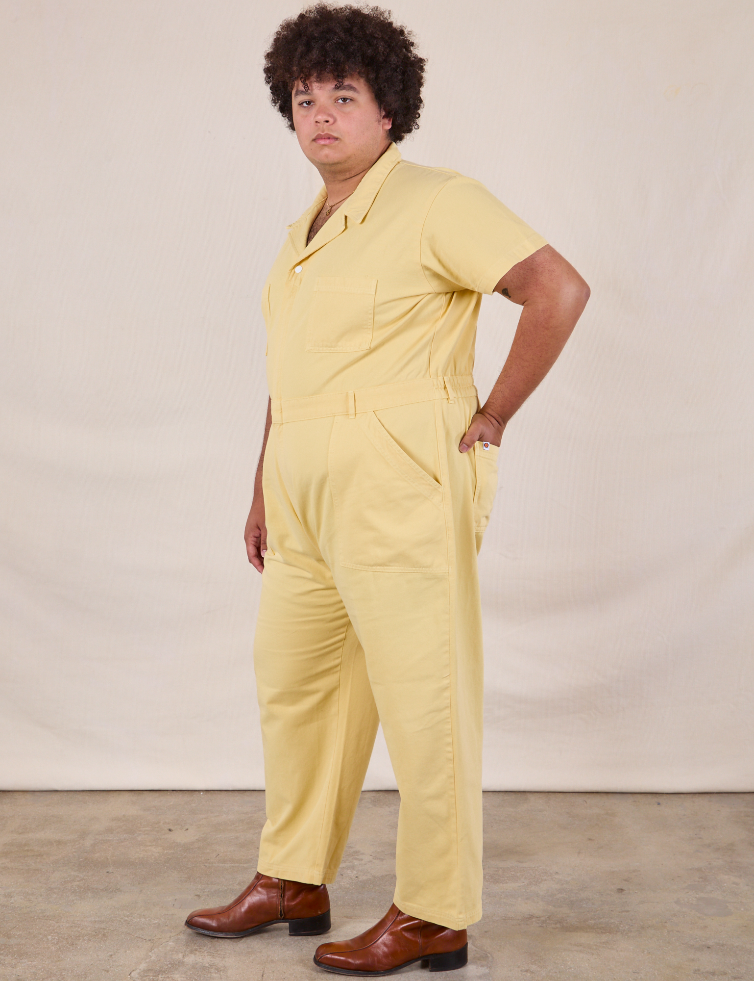 Short Sleeve Jumpsuit in Butter Yellow side view on Miguel