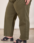 Short Sleeve Jumpsuit in Surplus Green pant leg side view on Bree