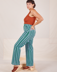 Side view of Stripe Work Pants in Green and burnt terracotta Cropped Tank Top