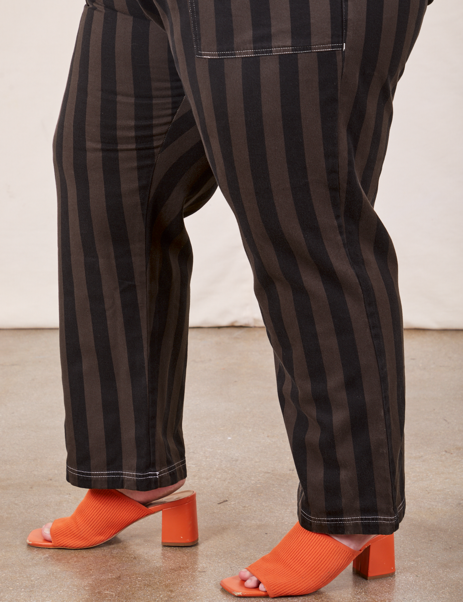Black Striped Work Pants in Espresso pant leg side view on Marielena