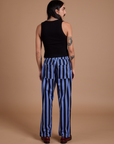Back view of Black Stripe Work Pants in Cornflower Blue and black Cropped Tank on Anthony