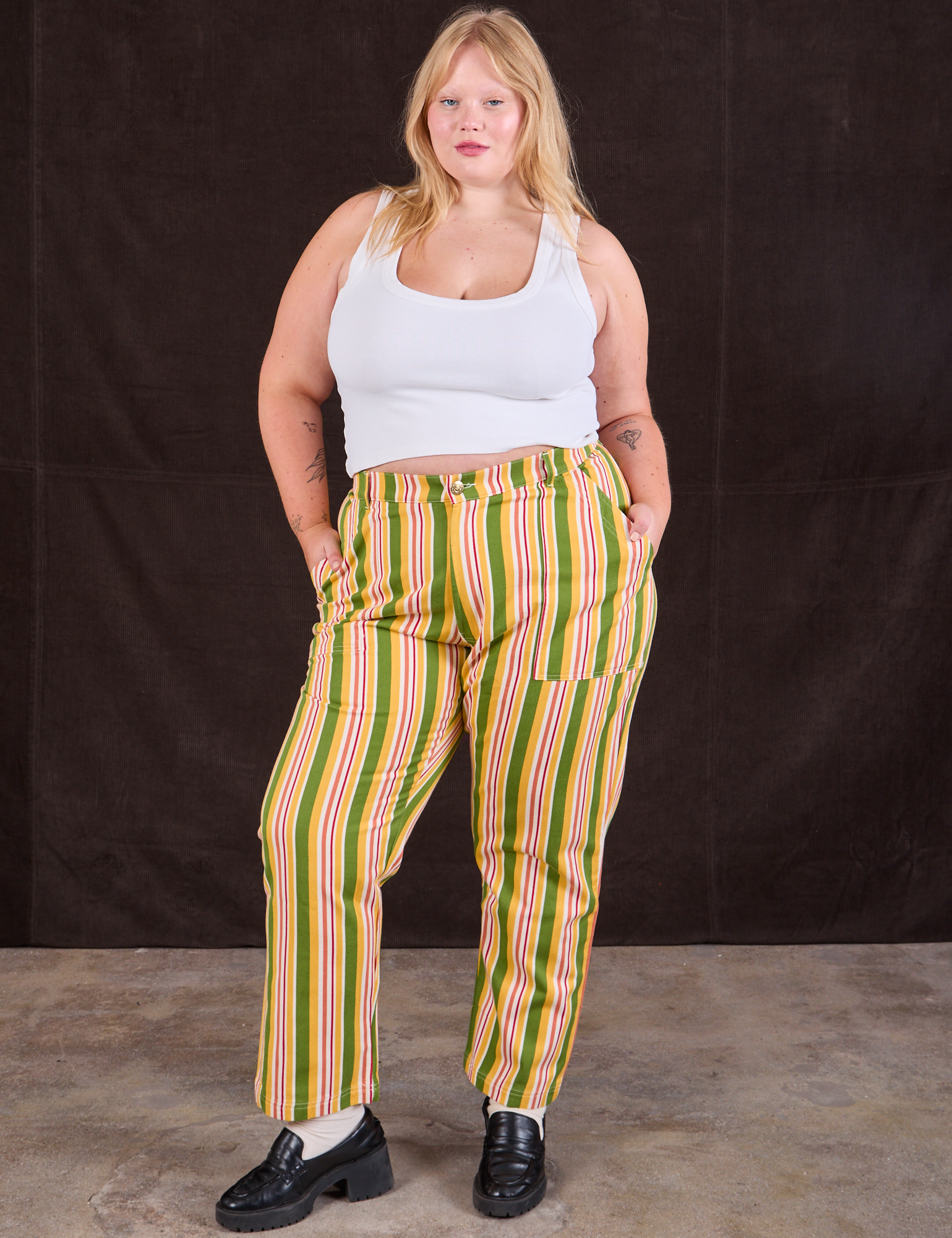 Juliet is 5&#39;7&quot; and wearing 1XL Stripe Work Pants in Vintage Sofa paired with a Cropped Tank in vintage tee off-white