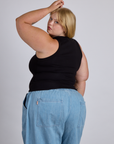 Angled back view of The Tank Top in Basic Black on Juliet