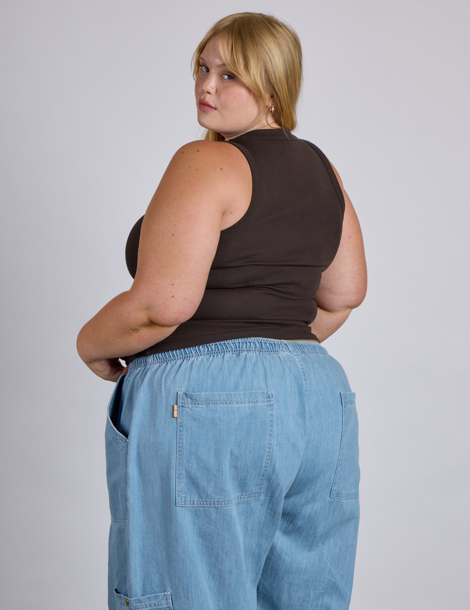 Angled back view of The Tank Top in Espresso Brown on Juliet