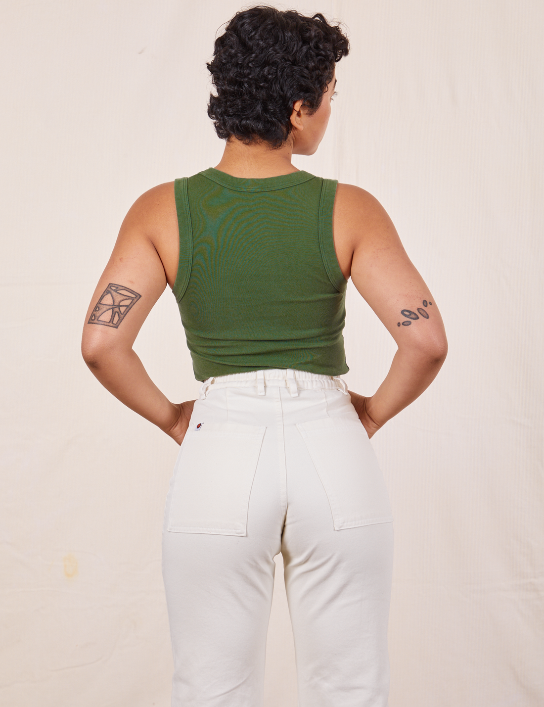 Tank Top in Dark Emerald Green back view on Mika wearing vintage off-white Western Pants