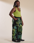 Side view of Magic Waters Drop Pocket Pants in Green Pool and gross green Cropped Tank on Demi