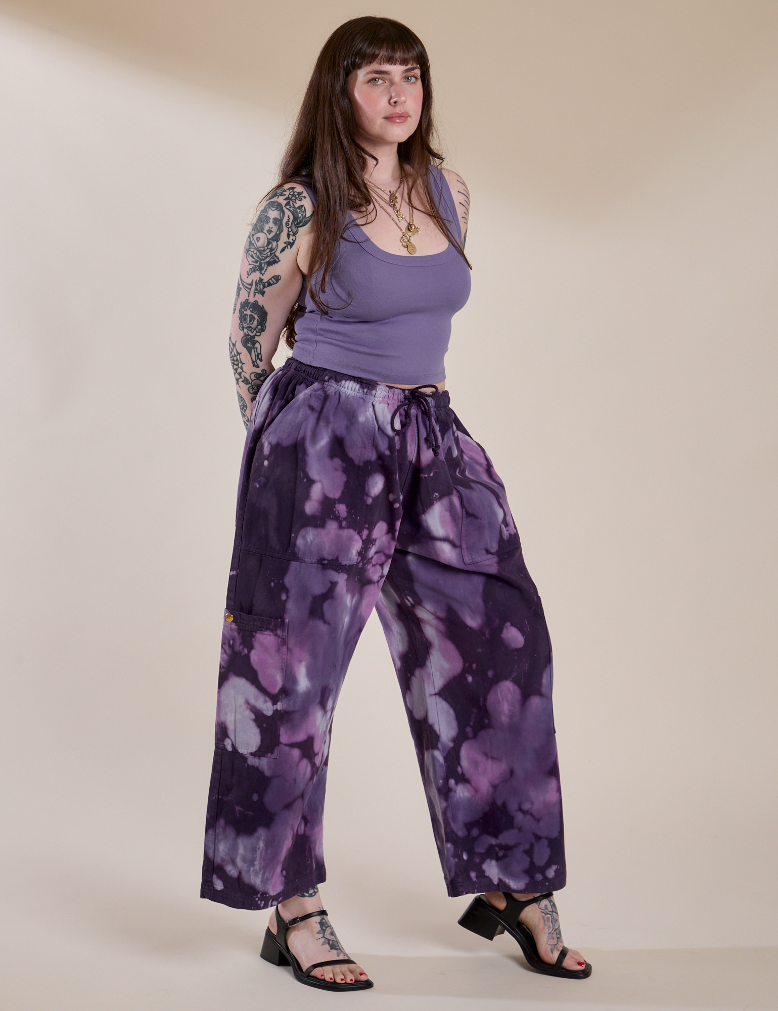Angled front view of Magic Waters Drop Pocket Pants in Dark Lavender and faded grape Cropped Tank on Sydney
