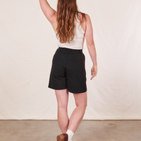 Back view of Trouser Shorts in Basic Black and vintage off-white Tank Top worn by Allison