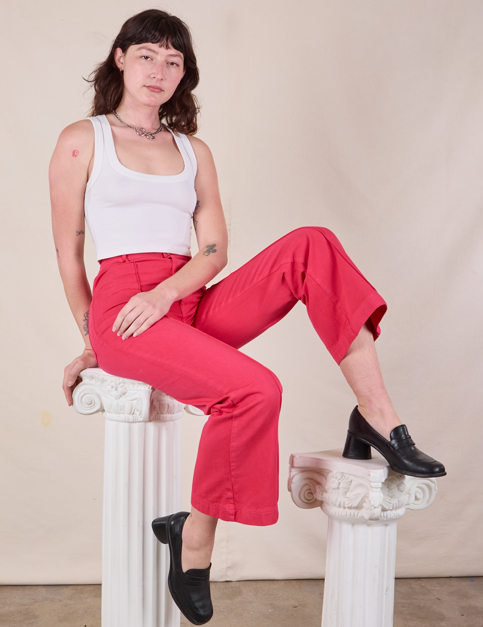 Alex is wearing Western Pants in Hot Pink and Cropped Tank in vintage tee off-white