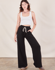 Alex is 5'8" and wearing P Wide Leg Sweat Pants in Basic Black paired with Cropped Tank in vintage tee off-white